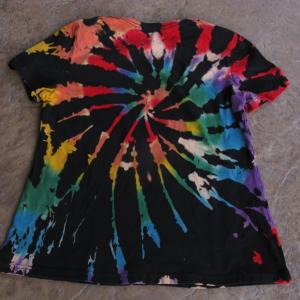 A T-shirt with a spiral pattern alternating between black and other colors